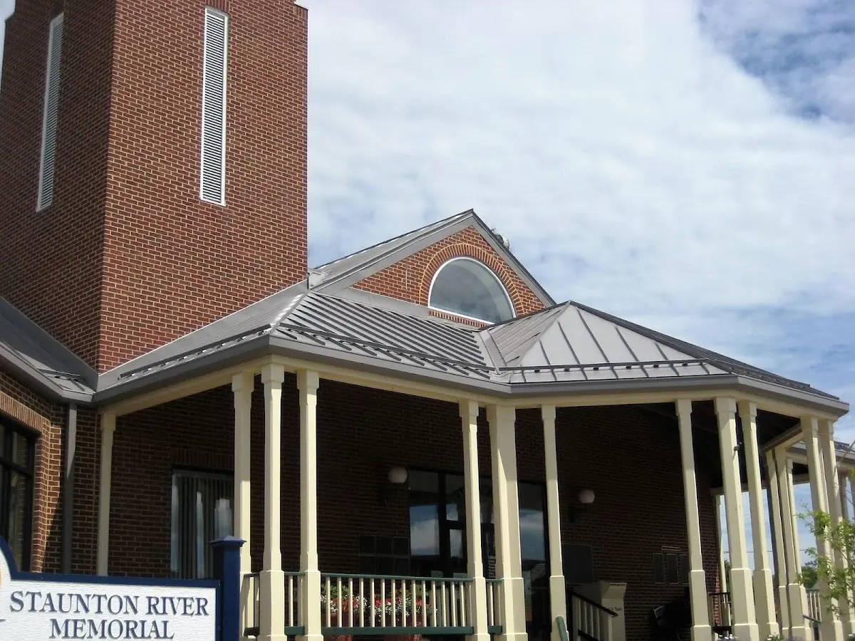 Skilled roofing craftsmen working on a residential roof in Swoyersville